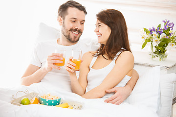 Image showing Relaxed Couple in Bed in bedroom at home