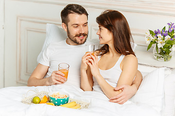 Image showing Relaxed Couple in Bed in bedroom at home