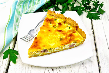 Image showing Quiche with pumpkin and bacon in white plate on table