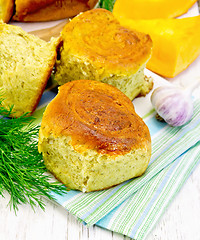 Image showing Scones pumpkin with garlic on board