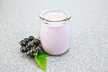 Image showing Milk cocktail with black currant in jar on granite table