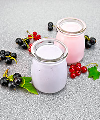 Image showing Milk cocktail with black and red currant on granite table