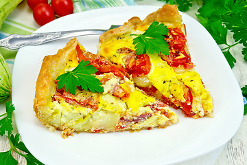 Image showing Flan with tomato and zucchini in plate on napkin