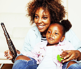 Image showing adorable sweet young afro-american mother with cute little daugh