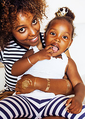 Image showing adorable sweet young afro-american mother with cute little daugh