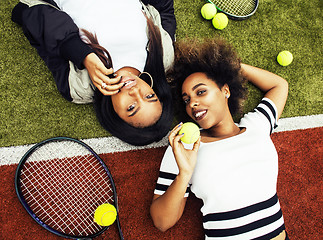 Image showing young pretty girlfriends hanging on tennis court, fashion stylis