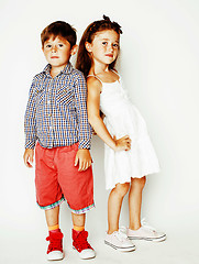 Image showing little cute boy and girl hugging playing on white background, ha