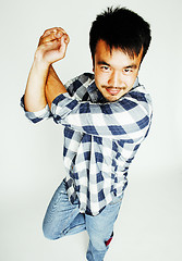 Image showing young cute asian man on white background gesturing emotional, po