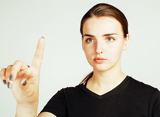 Image showing young pretty girl pointing on white background, business science