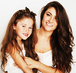 Image showing young mother with little cute daughter emotional posing on white