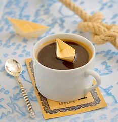 Image showing coffee cup and paper boat