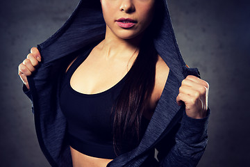 Image showing close up of woman posing and showing sportswear