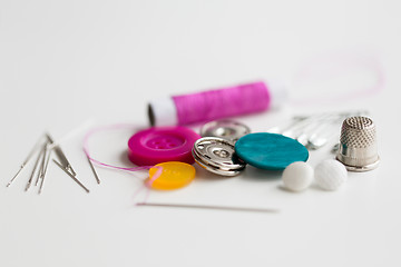 Image showing sewing buttons, needles, pins and thread spool