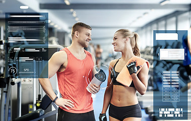 Image showing smiling man and woman talking in gym