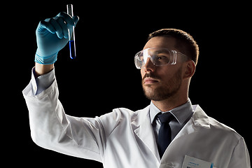 Image showing scientist in safety glasses with test tube