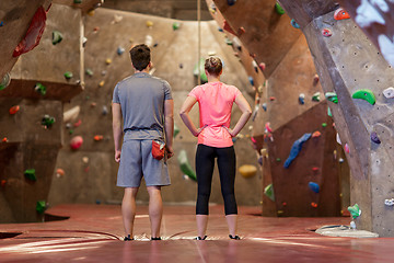 Image showing man and woman exercising at indoor climbing gym