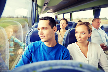 Image showing happy couple or passengers in travel bus