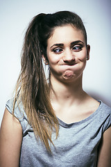 Image showing problem depressioned teenage with messed hair and sad face, real