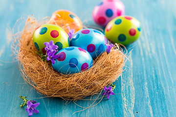 Image showing Colorful Easter eggs with spring flowers