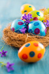 Image showing Colorful Easter eggs with spring flowers