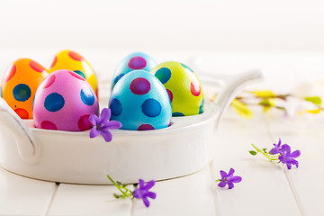 Image showing Colorful Easter eggs with spring flowers