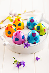 Image showing Colorful Easter eggs with spring flowers