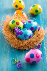 Image showing Colorful Easter eggs with spring flowers