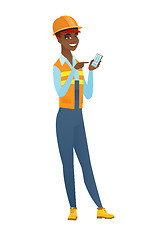 Image showing African-american builder holding a mobile phone.