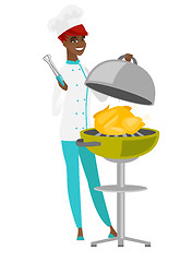 Image showing Chef cook cooking chicken on barbecue grill.