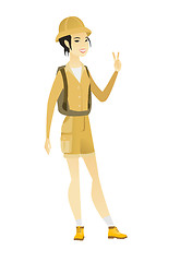 Image showing Asian traveler showing victory gesture.