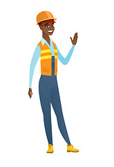 Image showing Young african-american builder waving her hand.