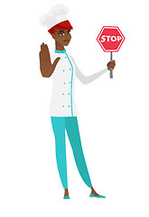 Image showing African-american chef cook holding stop road sign.