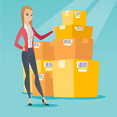 Image showing Business woman checking boxes in warehouse.