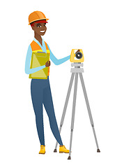 Image showing African surveyor builder working with theodolite.