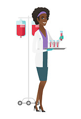 Image showing Laboratory assistant analyzing blood in test tube.
