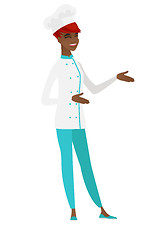 Image showing Young african-american happy chef cook gesturing.