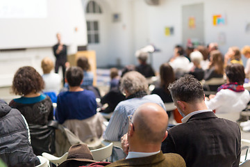 Image showing Woman giving presentation in lecture hall at university.