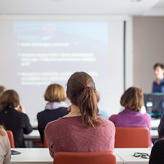 Image showing Woman giving presentation in lecture hall at university.