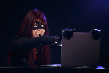 Image showing Brunette in mask of thief