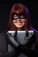 Image showing Beautiful hacker in black gloves