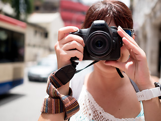 Image showing Girl with camera near face