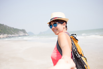 Image showing Young woman on sandy beach