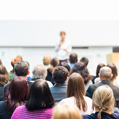 Image showing Woman giving presentation in lecture hall at university.