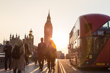 Image showing Traffic and random people on Westminster Bridge in sunset, London, UK.