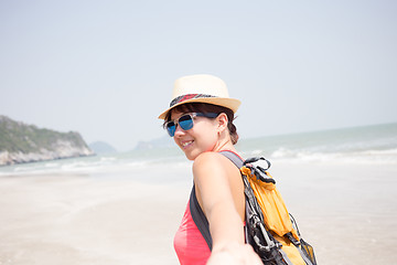 Image showing Young brunette on sandy beach