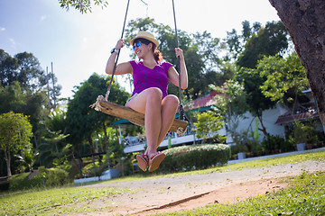 Image showing Woman on swing at beach