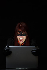 Image showing Screaming female hacker at night