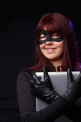 Image showing Laughing hacker in black gloves