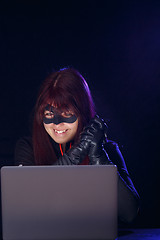 Image showing Night hacker girl in mask