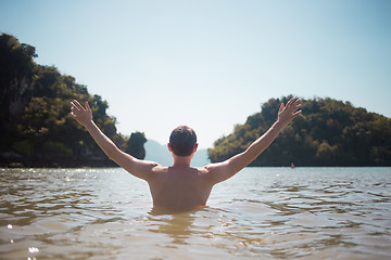 Image showing Man stands in sea during day